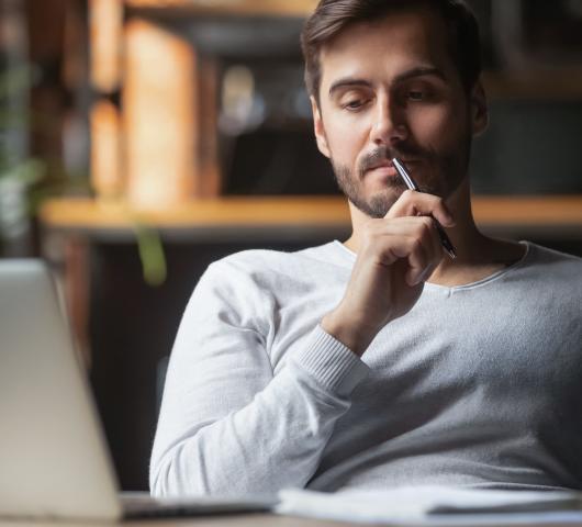Man thinking on computer